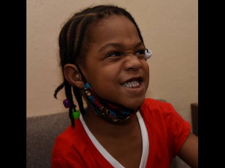 Jaydi-Ann enjoys herself after she was fitted with hearing aids.