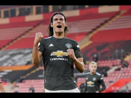 Manchester United’s Edinson Cavani celebrates after scoring his side’s second goal during an English Premier League match between Southampton and Manchester United at the St Mary’s stadium in Southampton, England, Sunday, November 29, 2020. 