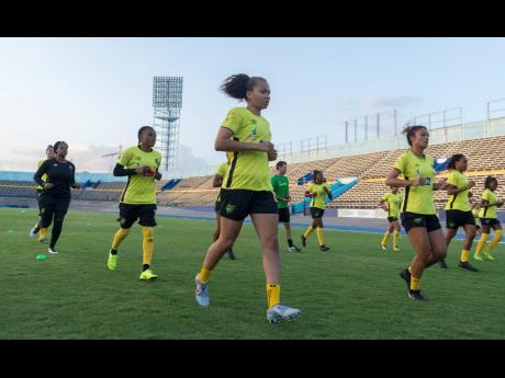 Members of the Reggae Girlz  jog during a training session at the National Stadium on Monday, May 13, 2019.