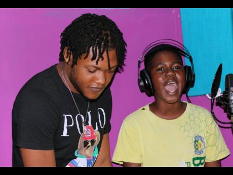 Credit: Stephanie Lyew Qrush (left) listens to his ‘student’ Dwayne Pascoe.