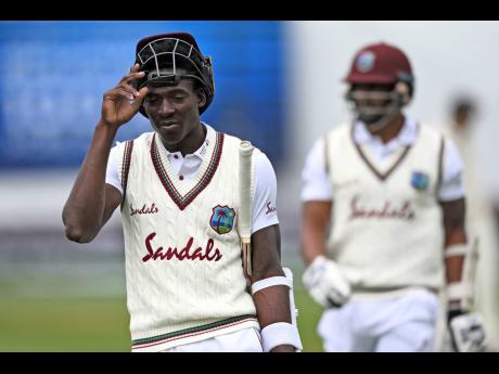 West Indies’ batsmen Chemar Holder, left, and Shannon Gabriel walk off after their loss to New Zealand on the fourth day of their second cricket test at Basin Reserve in Wellington, New Zealand, Monday, December 14, 2020. 
