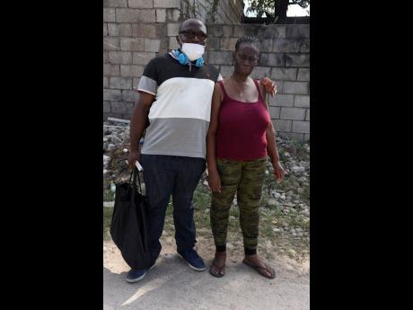 Damion Rose (who is blind) and his girlfriend, Charmaine Tucker were seen in Duhaney Park, St Andrew, yesterday.