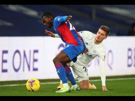 Crystal Palace’s Tyrick Mitchell (left) and Leicester’s Dennis Praet challenge for the ball during their English Premier League match at Selhurst Park Stadium in London on Monday.