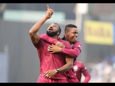 Credit: Aijaz Rahi West Indies’ captain Kieron Pollard (left) celebrates the dismissal of India’s captain Virat Kohli during the second one day international cricket match between India and West Indies in Visakhapatnam, India, Wednesday, December 18, 2019.