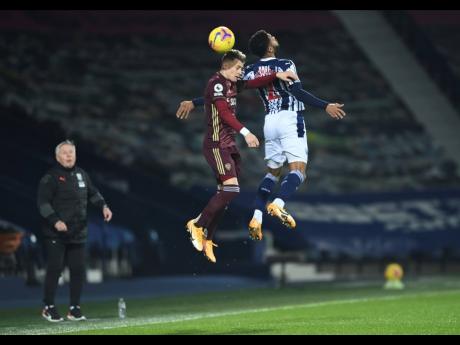 West Bromwich Albion’s Darnell Furlong ( right) and Leeds United’s Ezgjan Alioski challenge for the ball during their English Premier League match United at The Hawthorns stadium, West Bromwich, England, yesterday.