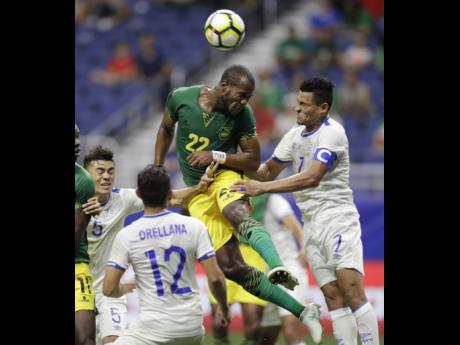 File
Jamaica’s Romario Williams (second right) tries to make a shot on goal against El Salvador’s Darwin Ceren (right) during a Concacaf Gold Cup match in San Antonio in  July 2017.