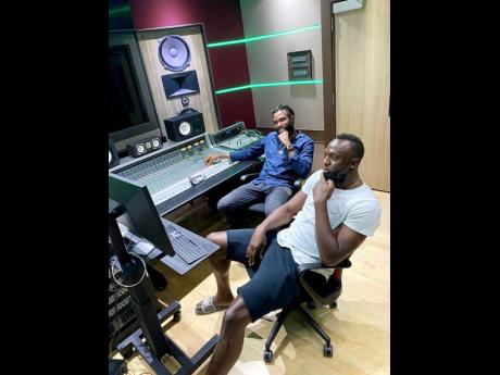 NJ (left) and Usain Bolt in the studio.