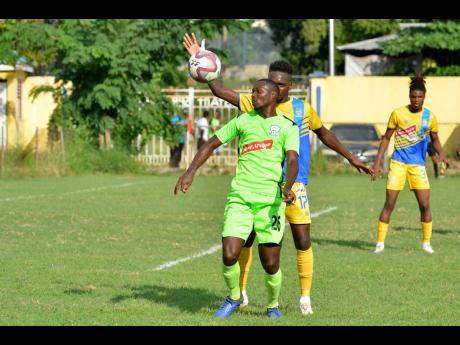 File
Harbour View FC’s Damion Thomas battles for the ball with Molynes United’s Romario Campbell in a Premier League match at the Constant Spring Football Field on November 27, 2019.