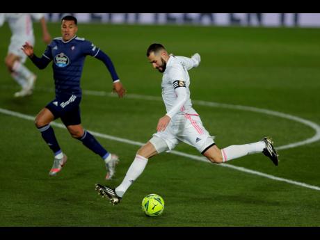 Real Madrid’s Karim Benzema shoots the ball during the Spanish La Liga match against Celta Vigo at the Alfredo Di Stefano Stadium in Madrid, Spain, on January 2.
