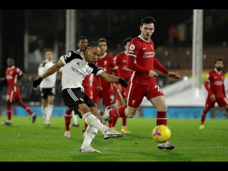 AP Photos
Fulham’s Bobby Decordova-Reid scores the opening goal during the English Premier League match against Liverpool, at Craven Cottage.