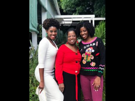 Rosemarie Scott (centre) is flanked by daughters Zaneta (left) and Zuri.