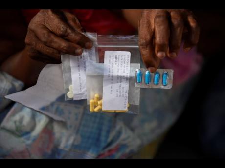 Yvette Spencer, of Maxfield Park, St Andrew, thinks her paralysis may have resulted from medication she received from a doctor who is treating her for back pains. 