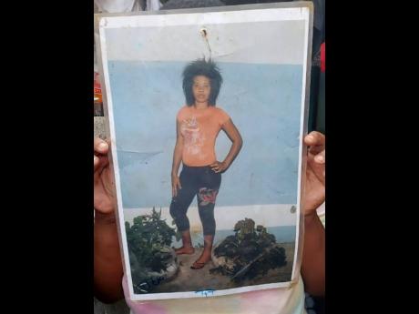 A resident shows a picture of Margarita Campbell.