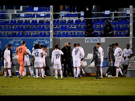 AP
Real Madrid’s head coach Zinedine Zidane (centre) speaks with his players as the Spanish Copa del Rey round of 32 match between Alcoyano and Real Madrid goes into extra time at the El Collao stadium in Alcoy, Spain, Wednesday, January 20. 
