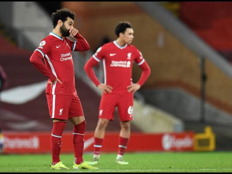 Liverpool’s Mohamed Salah (left) looks on following the English Premier League match between Liverpool and Burnley in Liverpool, yesterday.