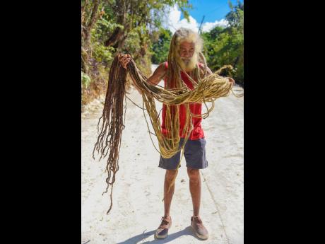 Rupert Scott’s locks are about 20 feet long.