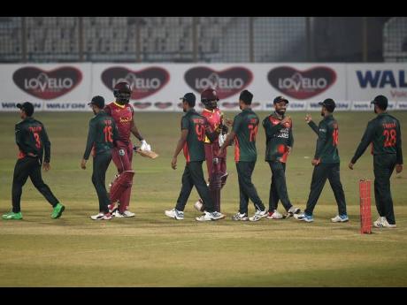 Bangladesh’s players celebrate after wrapping up their third win in the three match One Day International series yesterday.