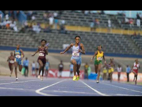 FILE
Edwin Allen High School’s Tia Clayton anchors their Class Two 4x100m team to victory in a record 43.73 seconds.