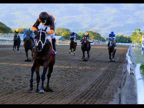 Eroy, ridden by Omar Walker, wins the Ash Wednesday Trophy, the 11th race at Caymanas Park, over six and a half furlongs yesterday.