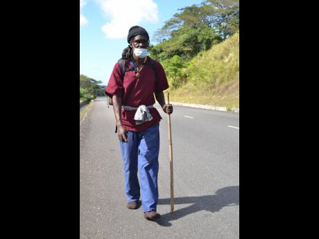 Despite suffering injuries to his feet, Black X is determined to continue his walk to Jamaica House, in salute of healthcare workers and Tacky.