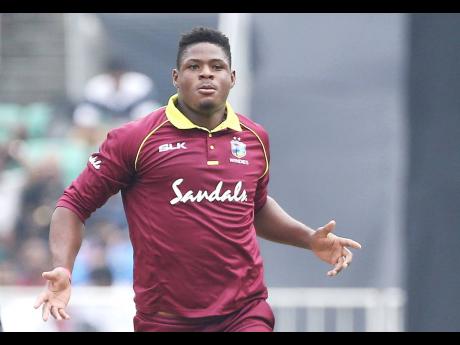 West Indies’ Oshane Thomas celebrates the dismissal of India’s Shikhar Dhawan during the fifth and last one-day international cricket match against India  in Thiruvananthapuram, India, in  November 2018. 