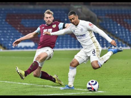 Burnley's Charlie Taylor (left) in action with Leicester's Youri Tielemans during the English Premier League match between Burnley and Leicester City at Turf Moor stadium in Burnley, yesterday.