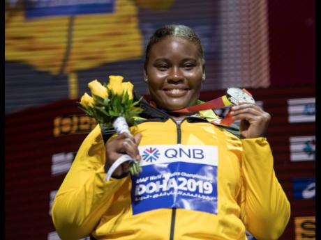 Danniel Thomas-Dodd smiles as she shows off her silver medal during the medal presentation for the women’s shot put  at the 2019 IAAF World Athletic Championships held at the Khalifa International Stadium in Doha, Qatar, on Friday October 4, 2019.