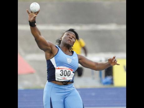 Danniel Thomas of Edwin Allen High School put the shot during the Class One girls Discus Throw on day three of the ISSA/GraceKennedy Boys and Girls’ Athletics Championships 2012.