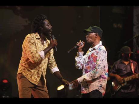 Beres Hammond (right) and long-time friend Buju Banton in performance.