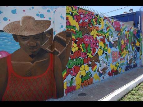 Credit: Kenyon Hemans One of the murals adding some colour to communities in Central Kingston. This one is on Water Lane.