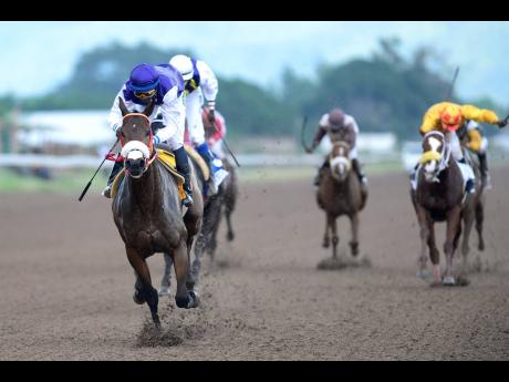 She’s A Maneater (front), ridden by Omar Walker, is one of the most successful horses trained by DaCosta, having won the Triple Crown in 2017, and the Diamond Mile.