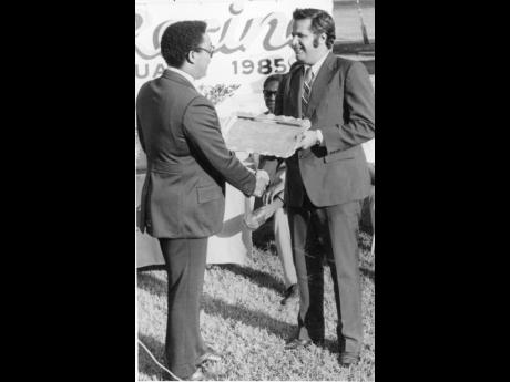 In this file photo from February 1985, DaCosta (right) receives an award from Trainer’s Association President Delroy Wallace at the Salute To Racing ceremony at Caymanas Park.