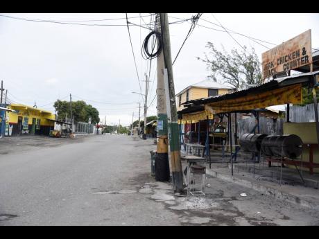 These pan chicken spots in Yallahs, St Thomas, are usually packed with customers awaiting tasty treats. Last Saturday, the area was a ghost town as the noon curfew took effect.