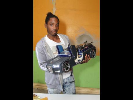 Credit: Nathaniel Stewart Oshane Dunstan has been making miniature cars in his community of Simon in Rock River, Clarendon.