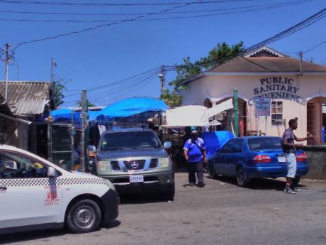 Motorists are parked outside a section of the Lucea Market in Hanover.