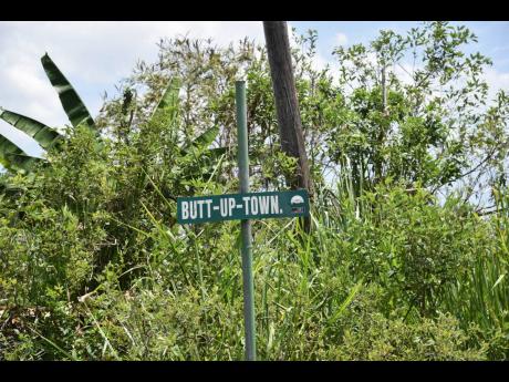 This sign shows that you are in Butt-Up-Town, Trelawny. Would you live there?