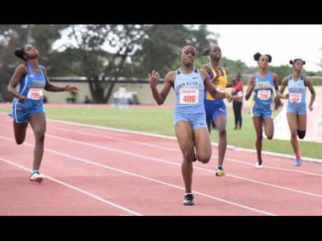 Tina Clayton (second left) of Edwin Allen High wins the Class Two girls 200ms final  in 23.57 seconds ahead of Hydel High School’s Shenese Walker  at the 2020 edition of the Central Athletics Championships.