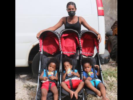 Aneka Robinson with her one-year-old triplets (from left) Tavaun, Tavoy and Tavere Gordon.