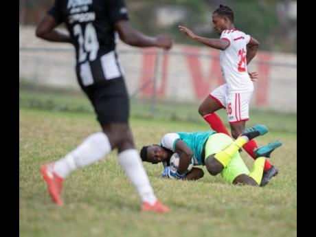 File
Cavalier FC goalkeeper Jeadine White secures the ball to repel an attack by UWI FC in Red Stripe Premier League on February 23, 2020.