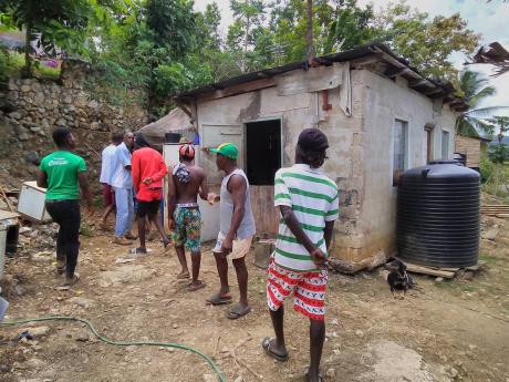 Residents of Parnassus, Trelawny, express their anger at the murder of Keeling.