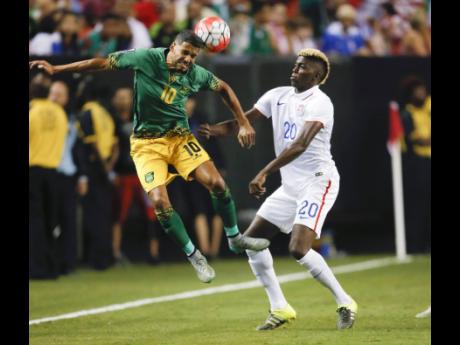 File
Jamaica’s Joel McAnuff (10) heads the ball in front of United States’ Gyasi Zardes (20) during the first half of a CONCACAF Gold Cup semi-final Wednesday, July 22, 2015, in Atlanta. 