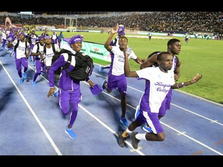 Credit: Gladstone Taylor Kingston College track team celebrate their 2019 Champs win.