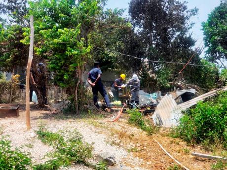 Fire investigators sift through the rubble.