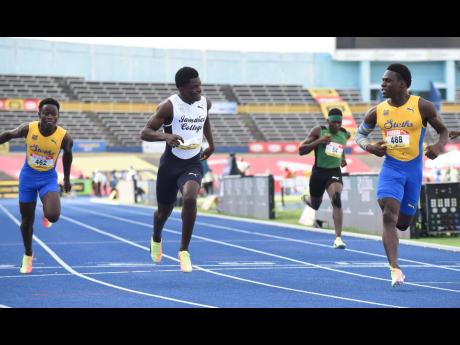 Orlando Wint (right) of St Elizabeth Technical wins the Class Two 100 metres final ahead of  Jamaica College’s Hector Benjamin (second left) and St Elizabeth Technical’s Javorne Dunkley (left).  Jevon Nelson (second right ) of Calabar High was eighth. The action is from last week’s ISSA/GraceKennedy Boys and Girls’ Championships.