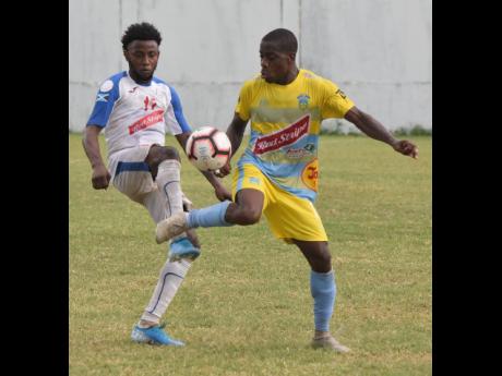In this file photo from November 2019, Tremaine Stewart (right), then of Waterhouse FC, controls the ball under pressure from Portmore United’s Tevin Shaw during a Jamaica Premier League game at the Spanish Town Prison Oval in Spanish, Town, St Catherine.