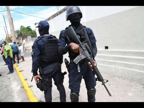 Members of the police force keep a watch on proceedings during the demonstration.