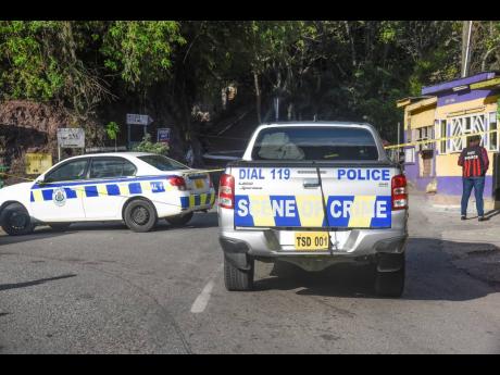 Credit: Nicholas Nunes Police process the scene in Irish Town where Steven Brown, 30, was shot and killed, allegedly by an off-duty cop.