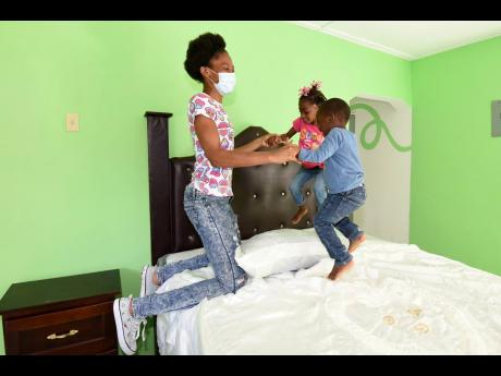 Mannings and her children, Kelecia Gayle
and Majeed-Selvin Thompson, are enjoying their new home.