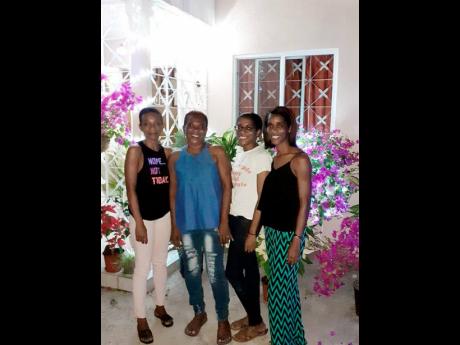 Valerie ‘Pansy’ Ennis (second left) and her daughters Elorine (left) Tashauna (second right) and Natasha.