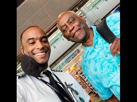 Credit: Contributed Anselm Dewar (left) and his father, Ashman.